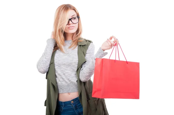 Beautiful young woman with red paper bag — Stock Photo, Image