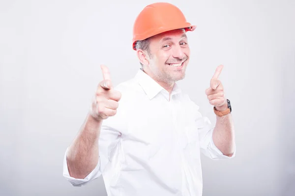 Portrait of contractor wearing hardhat pointing camera — Stock Photo, Image