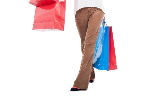 Waist down view of woman carrying shopping bags — Stock Photo, Image