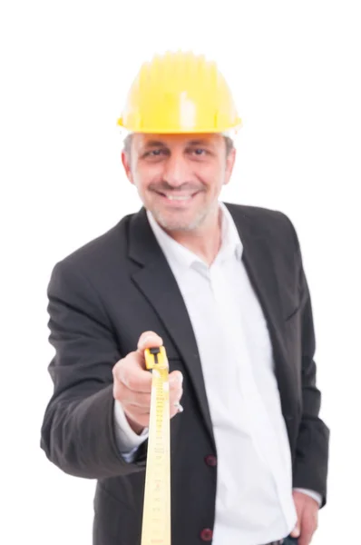 Selective focus of architect smiling holding ruler tape — Stock Photo, Image