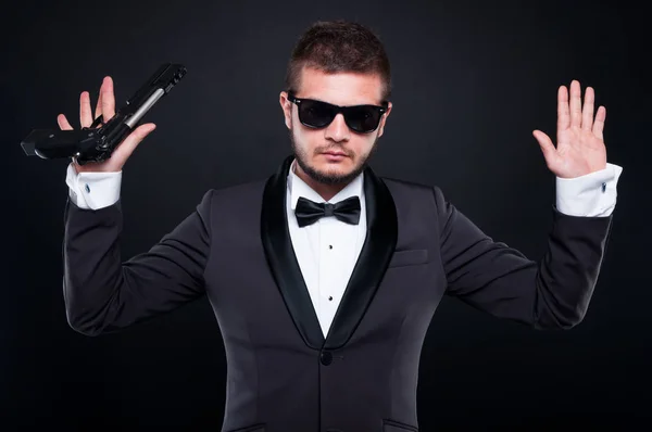 Armed young mafia gangster surrendering himself — Stock Photo, Image