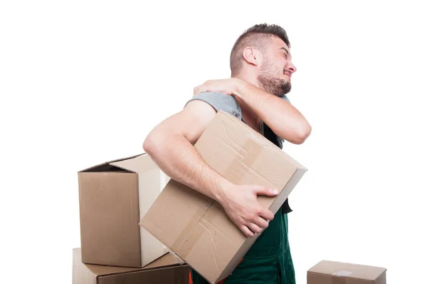 Mover man holding cardboard box and his shoulder — Stock Photo, Image