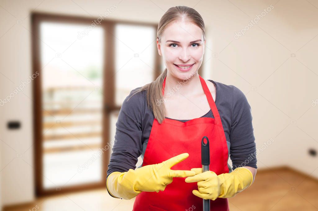 Joyful cleaning female counting two fingers