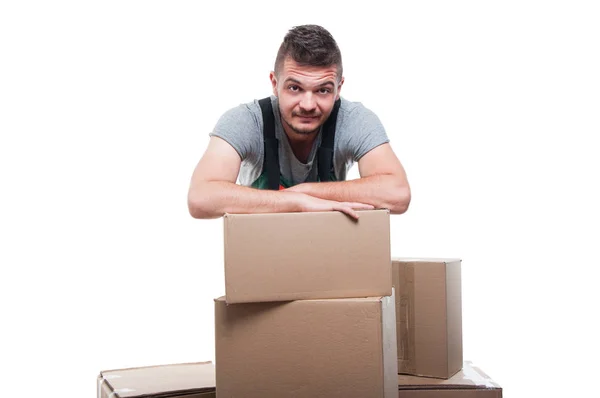 Portrait mover man posing behind cardboard boxes — Stock Photo, Image