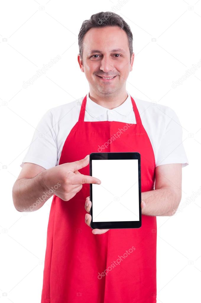 Modern supermarket seller holding blank tablet