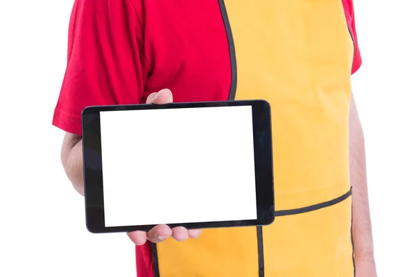 Supermarket employee holding digital tablet with copyspace