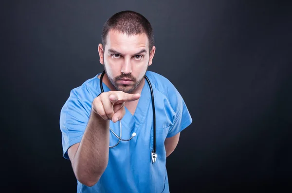 Doctor with stethoscope making watching you gesture — Stock Photo, Image