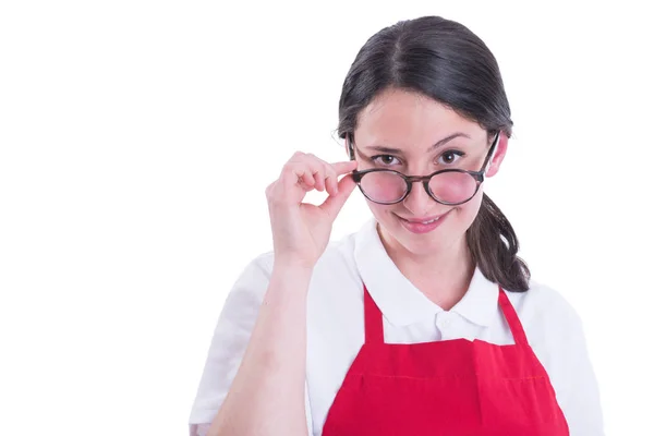 Portrait of attractive retailer looking over glasses — Stock Photo, Image