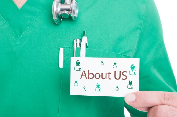 Doctor hand showing visit card for emergency call — Stock Photo, Image