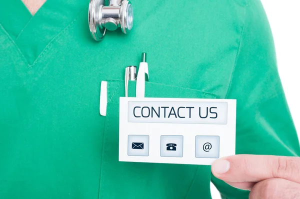 Male doctor or medic holding contact business card — Stock Photo, Image