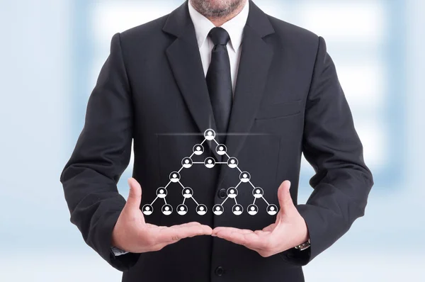 Business man with virtual icons of corporate network — Stock Photo, Image