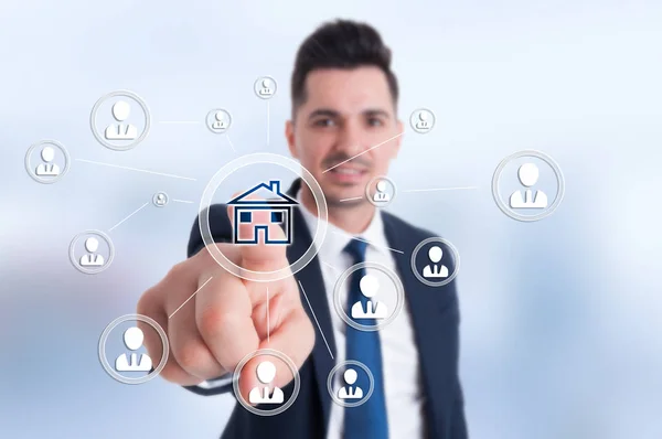 Businessman presses smart home icon — Stock Photo, Image