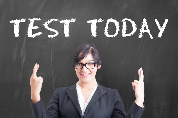 Beautiful woman teacher giving test to student — Stock Photo, Image