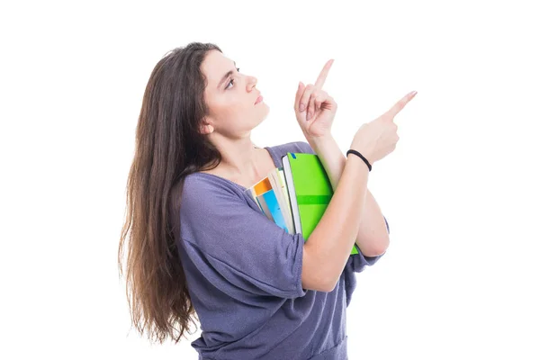 Kobieta Ładna studentka trzymania książek i wskazując palcem — Zdjęcie stockowe