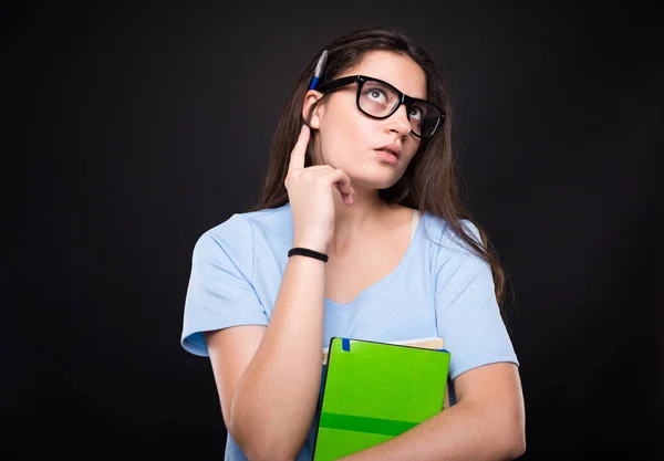 Pretty university student thinking and looking up — Stock Photo, Image