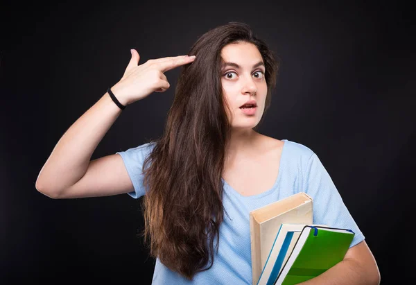 Student vrouwelijke op zoek verveeld van studie — Stockfoto