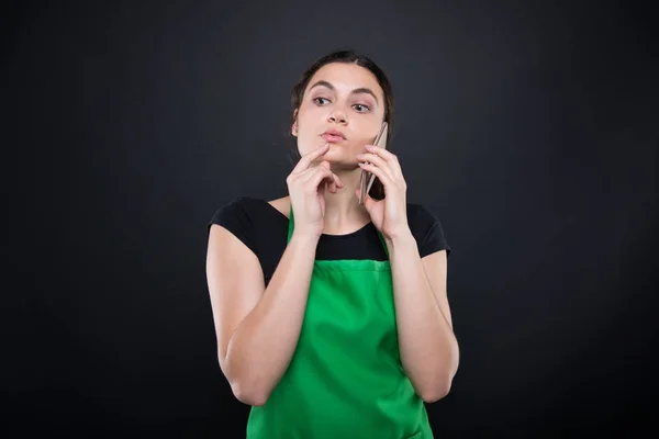 Supermarket female employee with green apron — Stock Photo, Image