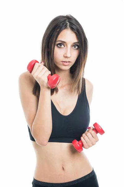 Porträt eines fitten Mädchens beim Training mit zwei Kurzhanteln — Stockfoto