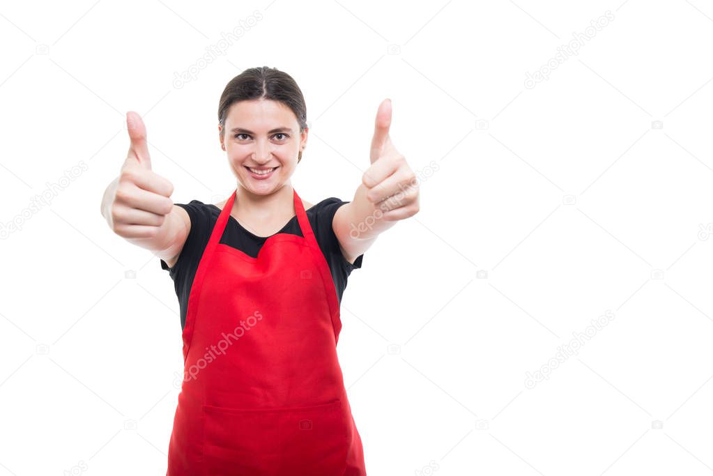 Cheerful girl seller rising both thumbs up