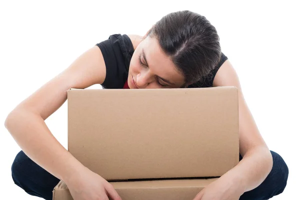 Young female seller embracing boxes with products — Stock Photo, Image