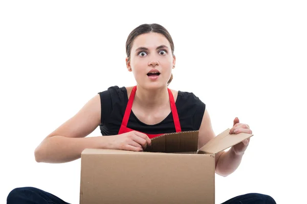 Excited girl clerk unboxing her delivery — Stock Photo, Image