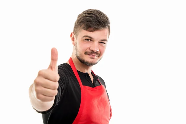 Vriendelijke mannelijke supermarkt werkgever tonen als gebaar — Stockfoto