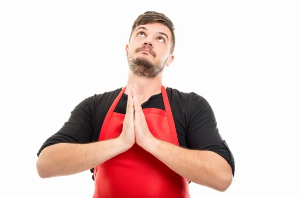 Hombre empleador de supermercado cogido de la mano como la oración — Foto de Stock