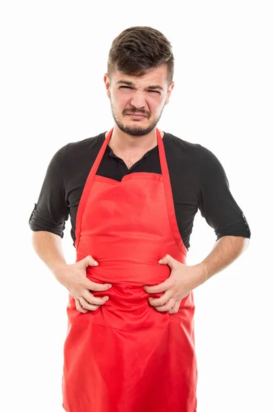 Masculino supermercado empregador segurando barriga como em dor — Fotografia de Stock