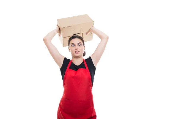 Angry seller girl throwing a cardboard box — Stock Photo, Image