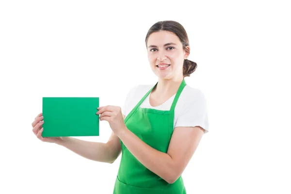 Mujer vendedora sosteniendo un libro verde —  Fotos de Stock