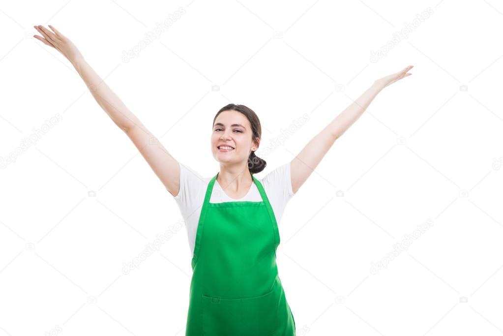 Successful supermarket employee celebrating with arms up