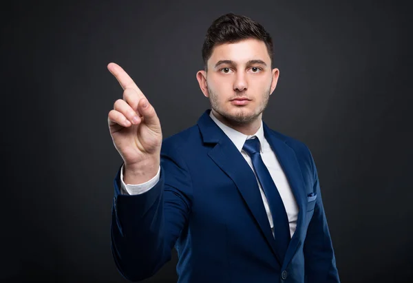 Male entrepreneur doing refusal sign with finger — Stock Photo, Image