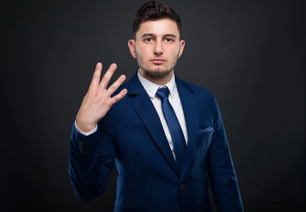 Businessman pointing up number number four — Stock Photo, Image