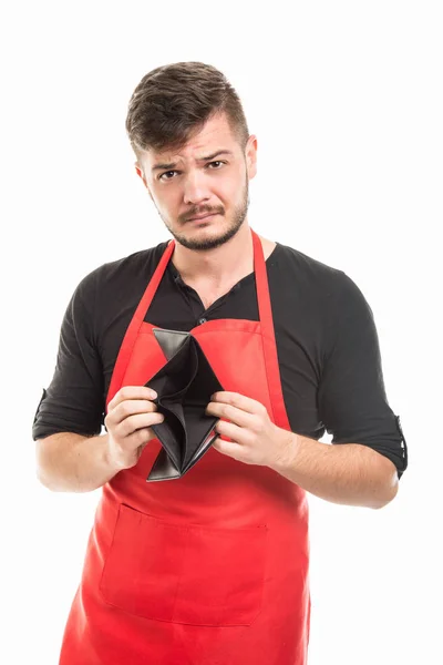 Supermarkt-Arbeitgeber zeigt leere Ledertasche — Stockfoto