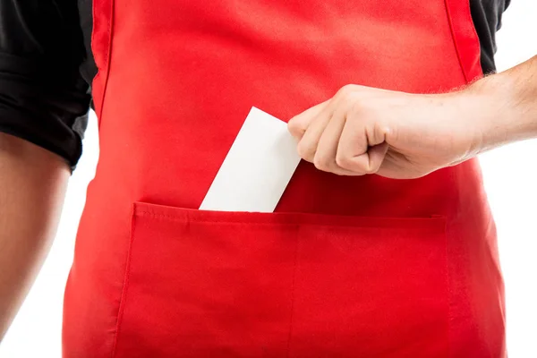 Close-up of supermarket employer putting business card in pocket — Stock Photo, Image