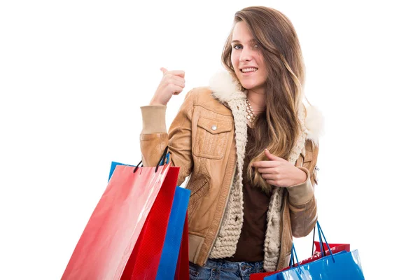 Attractive woman at shopping indicate something behind her — Stock Photo, Image