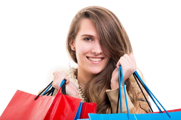 Young woman with shopping bags on white background — Stock Photo, Image