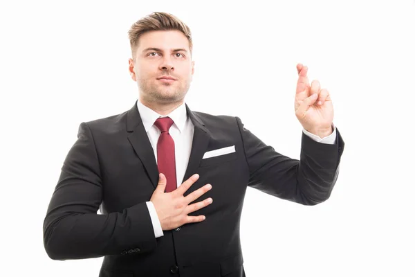 Handsome business man taking fingers crossed oath — Stock Photo, Image