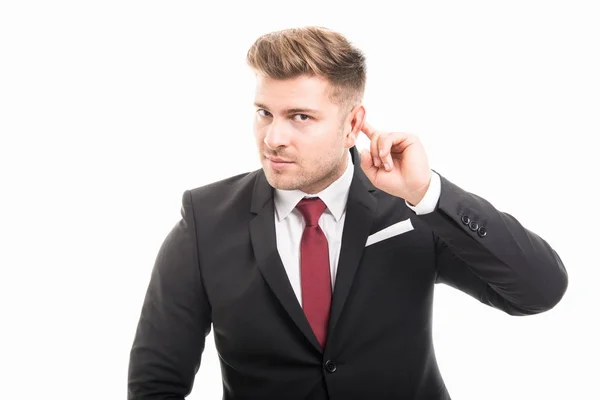 Bonito homem de negócios mostrando não ouvir gesto — Fotografia de Stock