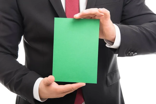 Primer plano del gerente mostrando cartón verde en blanco —  Fotos de Stock