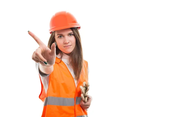 Kobiece konstruktora pokazuje palcem na białym tle — Zdjęcie stockowe
