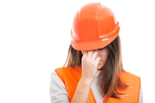 Engineer girl with hardhat got headache — Stock Photo, Image