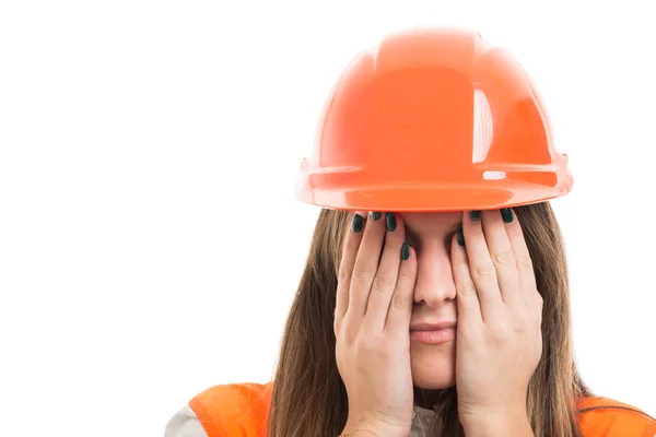 Portrait of scared woman engineer covering eyes — Stock Photo, Image