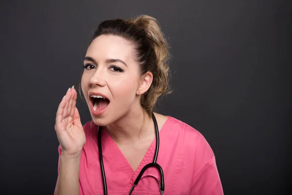 Portrait of attractive lady doctor making yelling gesture — Stock Photo, Image