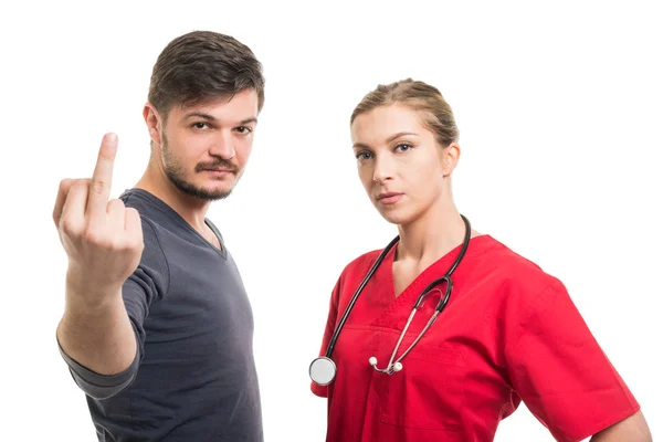 Bayan doktor ve erkek hasta orta finge gösterilen — Stok fotoğraf