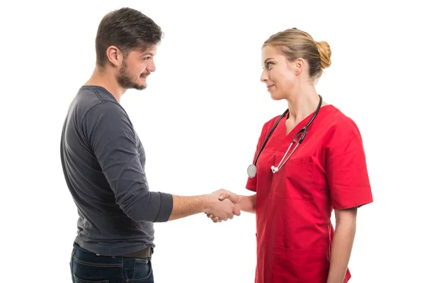 Male patient and female doctor shaking hand — Stock Photo, Image