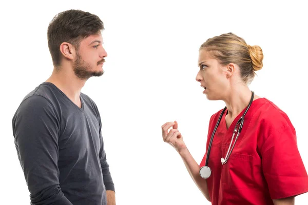 Lady doctor giving explanation to male patien — Stock Photo, Image