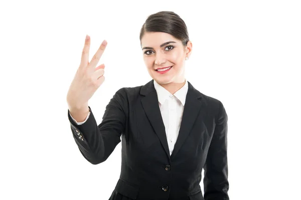 Portrait of beautiful female flight attendant showing number two — Stock Photo, Image