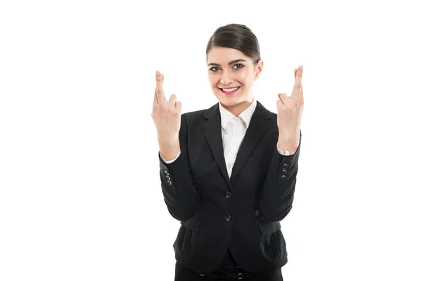 Beautiful female flight attendant holding both fingers crossed — Stock Photo, Image