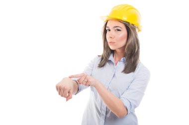 Portrait of female constructor showing being late gestur clipart